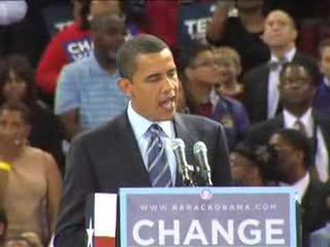 Obama at a political rally giving a speech in front of a podium