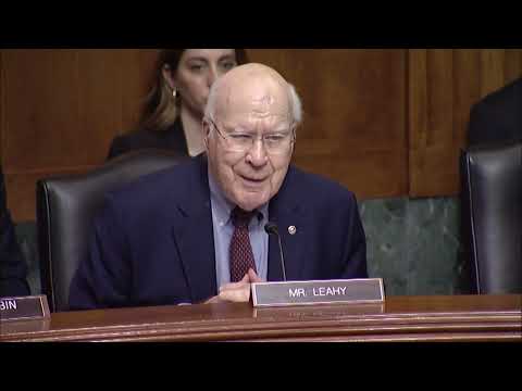 Pat Leahy sitting down in front of a microphone